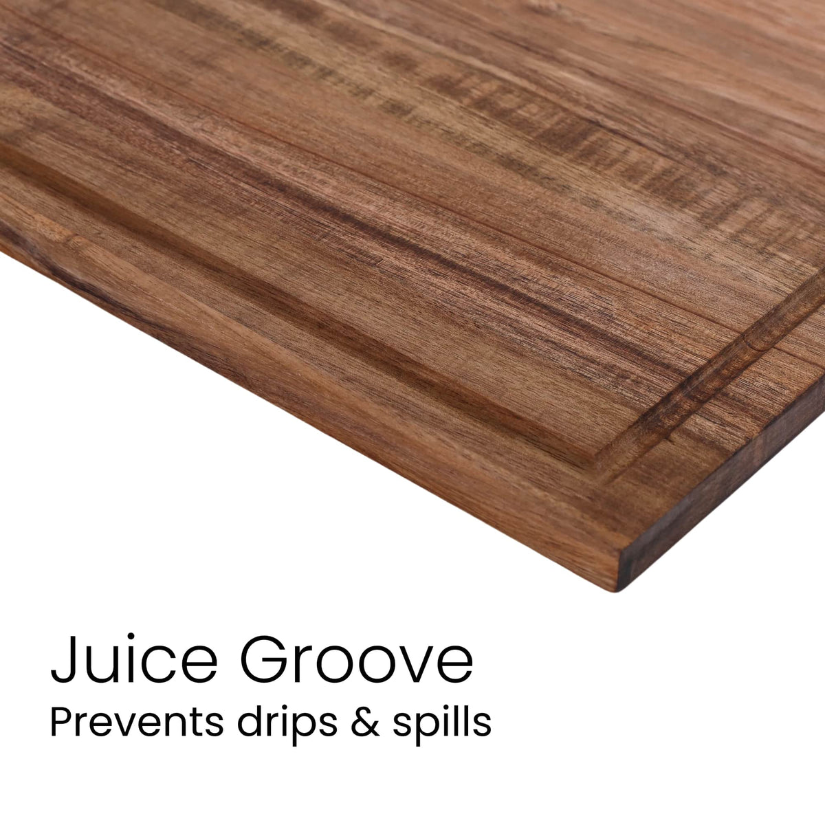 Close-up of acacia wood grain and juice groove on the serving board