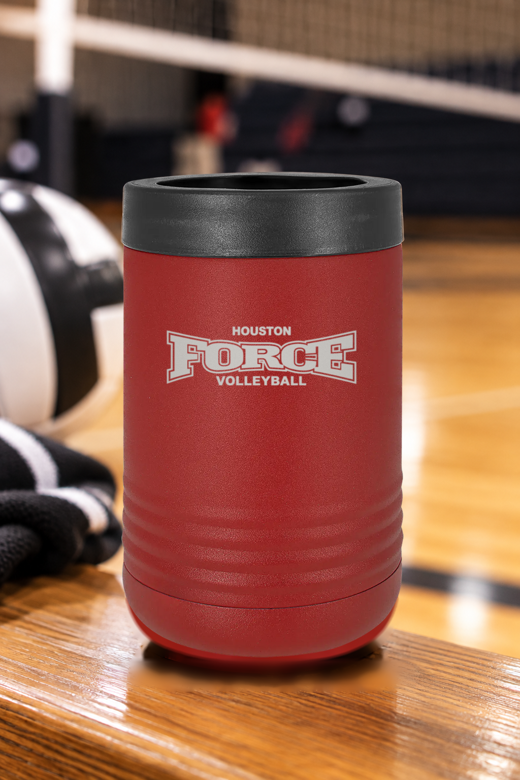 Houston Force Volleyball red beverage holder with black rim and approved classic logo engraving on a volleyball gym bench