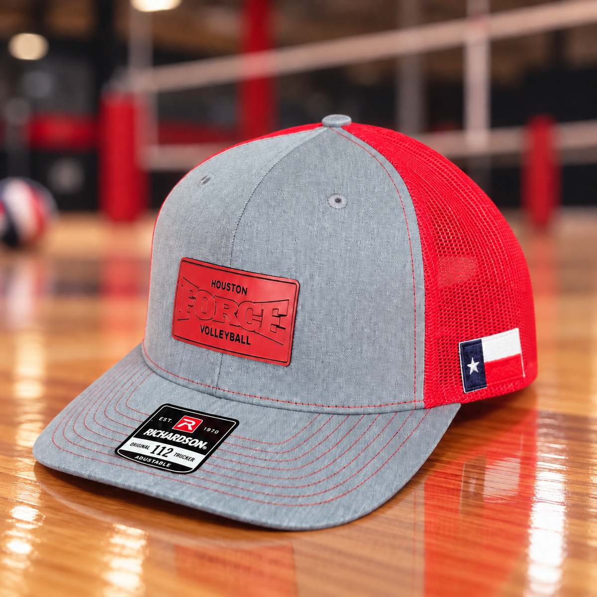 Houston Force gray and red Richardson 112 hat on a volleyball gym floor with engraved Force front patch and Texas flag side patch
