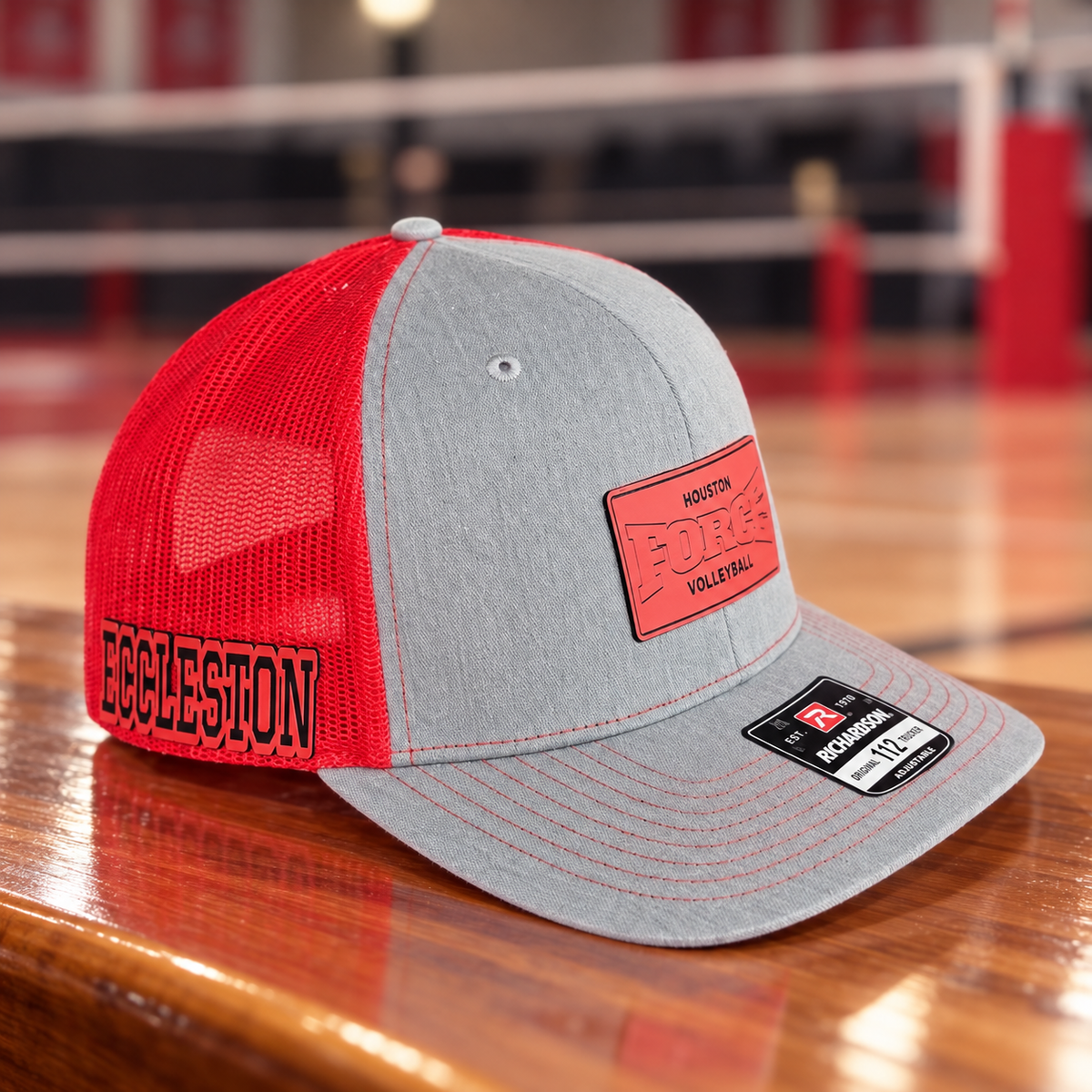 Houston Force Richardson 112 hat on a volleyball gym floor showing personalized name patch on the side and Force front patch