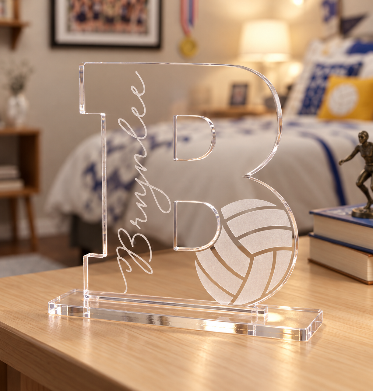 Personalized ¼-inch clear acrylic letter B with Brynlee name and frosted volleyball engraving, displayed in a flat clear acrylic base