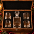 Open XL wooden keepsake box with fitted black insert holding the decanter and four rounded rocks glasses; all show matching THE THOMPSONS name-only engraving.