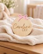 Personalized Wooden Baby Birth Announcement Sign in a warm naturally lit setting