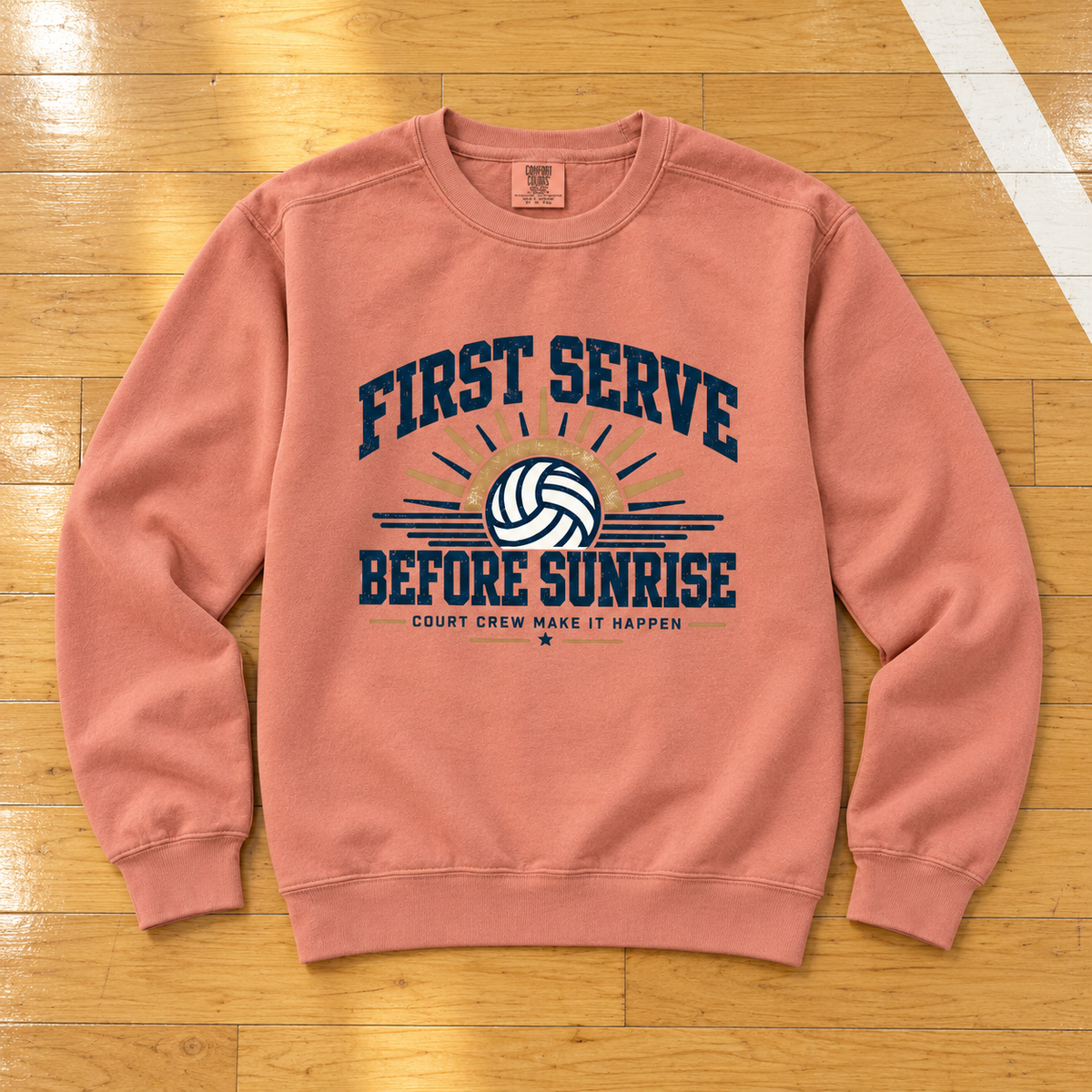 First Serve Before Sunrise Vintage Crewneck lying flat on a wooden volleyball court, photographed directly overhead