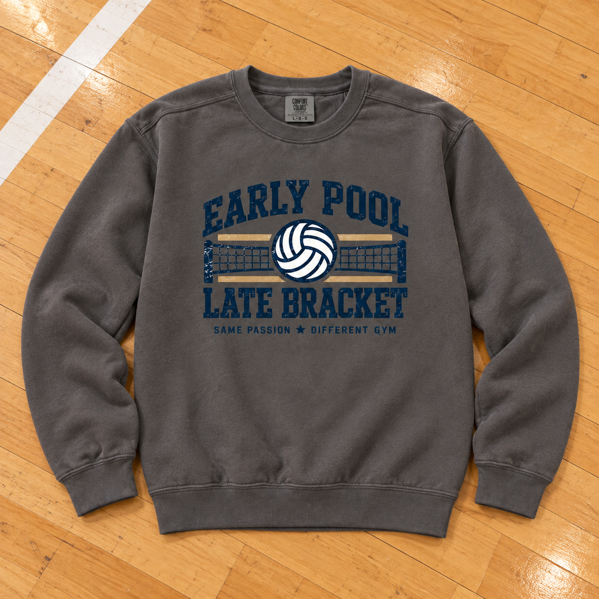 Early Pool • Late Bracket Vintage Volleyball Crewneck lying flat on a wooden volleyball court, photographed directly overhead