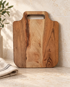 Personalized Square Acacia Cheese Board in a warm naturally lit setting
