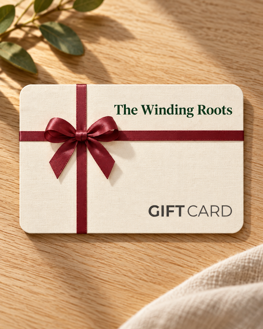 The Winding Roots Gift Card shown in a warm neutral setting